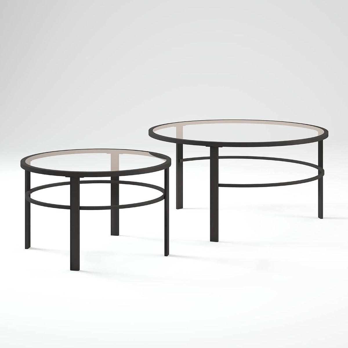 Staggered nesting tables shown side-by-side on a light backdrop, emphasizing slender legs and the double-ring support.