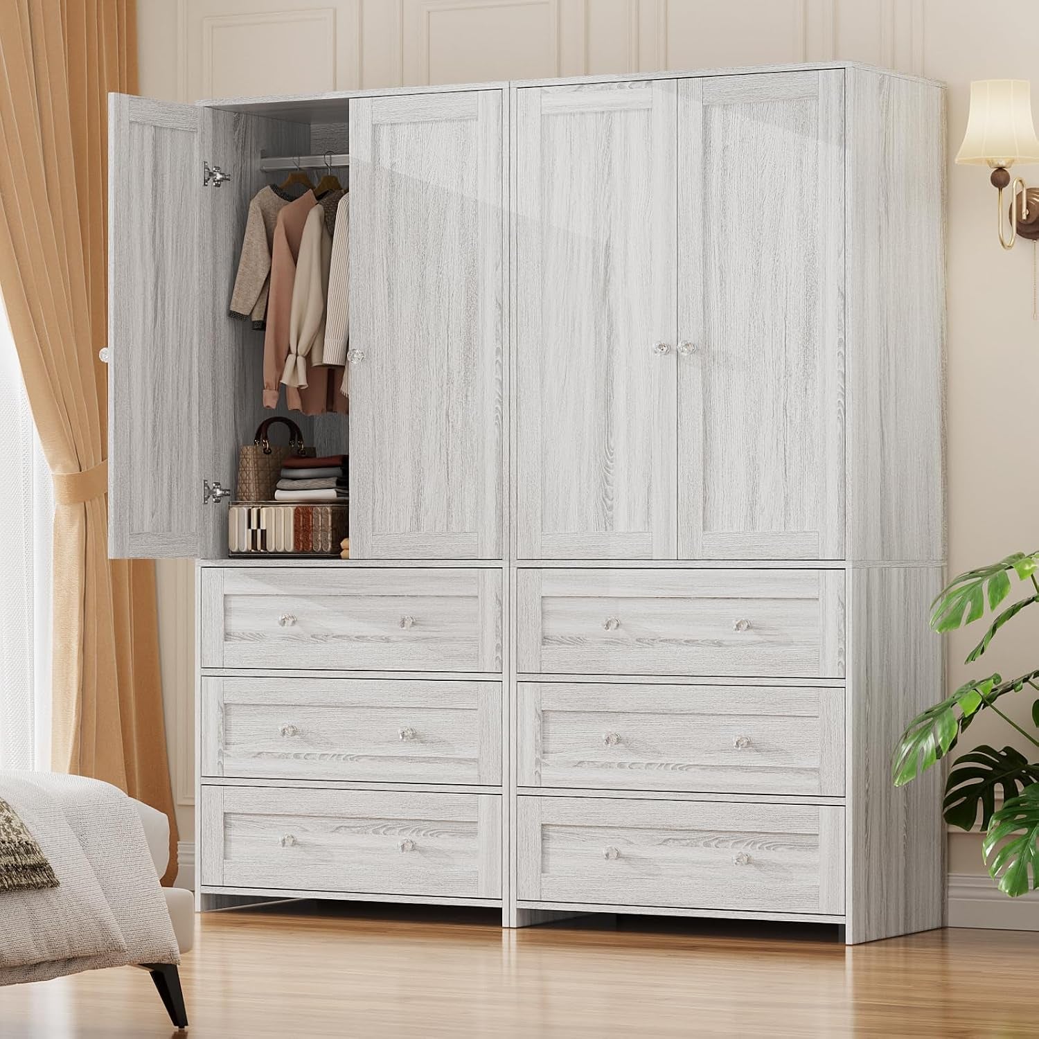 Two light-gray wardrobes placed side-by-side with one left door open revealing hanging clothes and stacked drawers below.