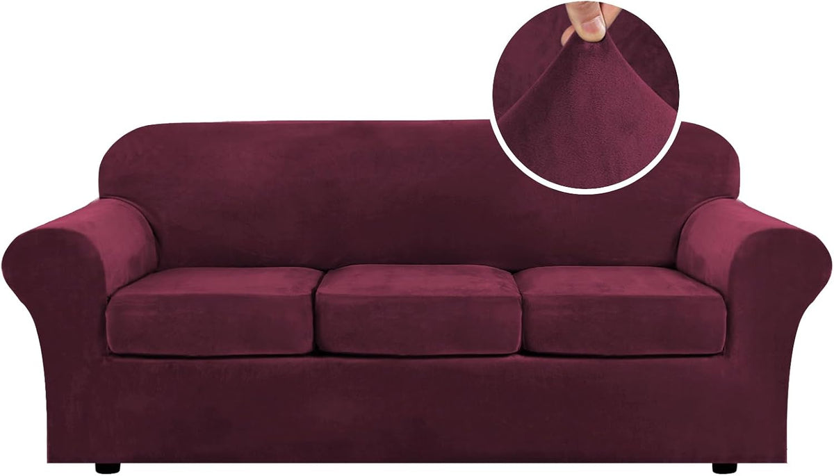 Front view of a three-cushion sofa in a deep burgundy stretch velvet slipcover with a fabric texture inset.