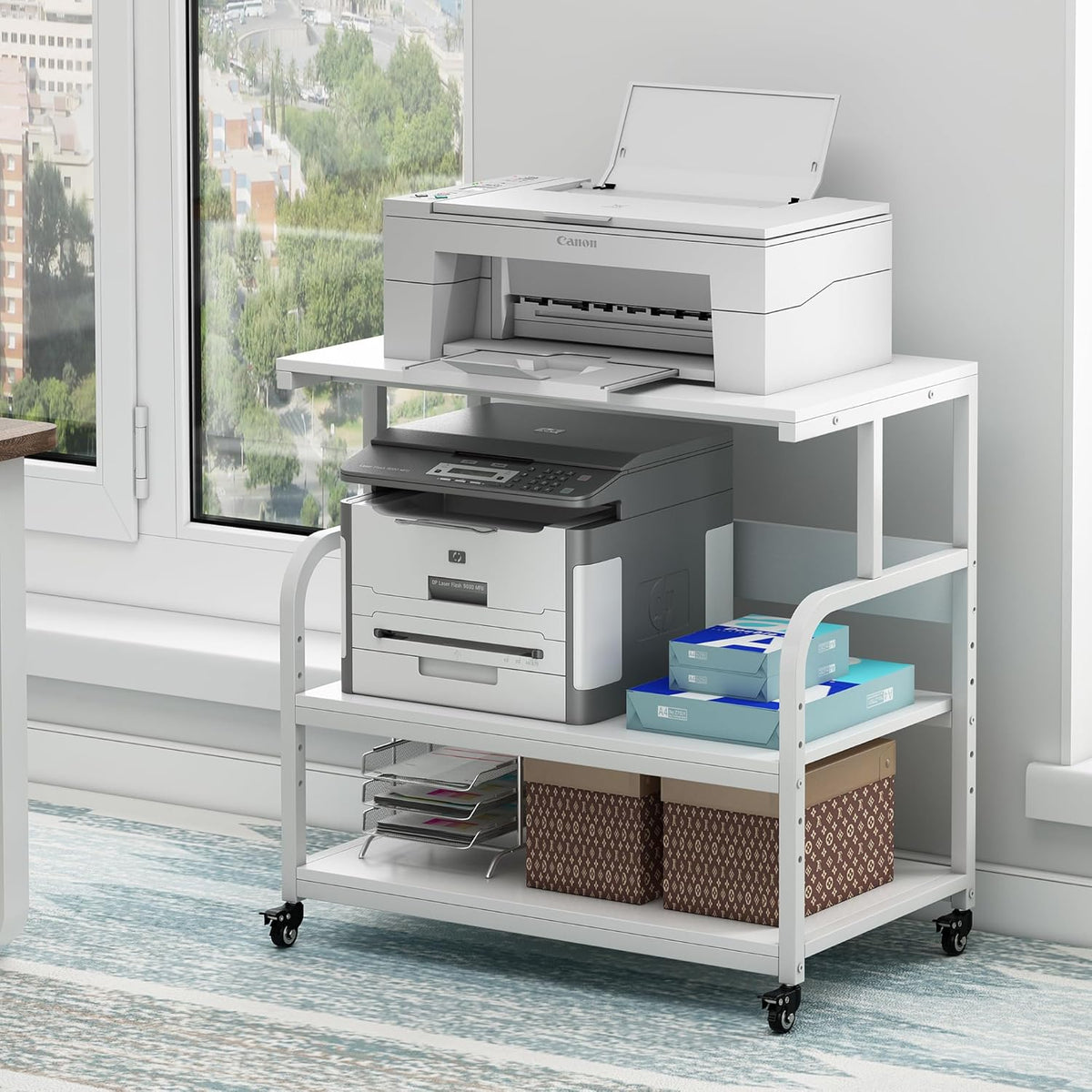 White stand with top printer lid open, middle printer visible and storage boxes on the bottom shelf.