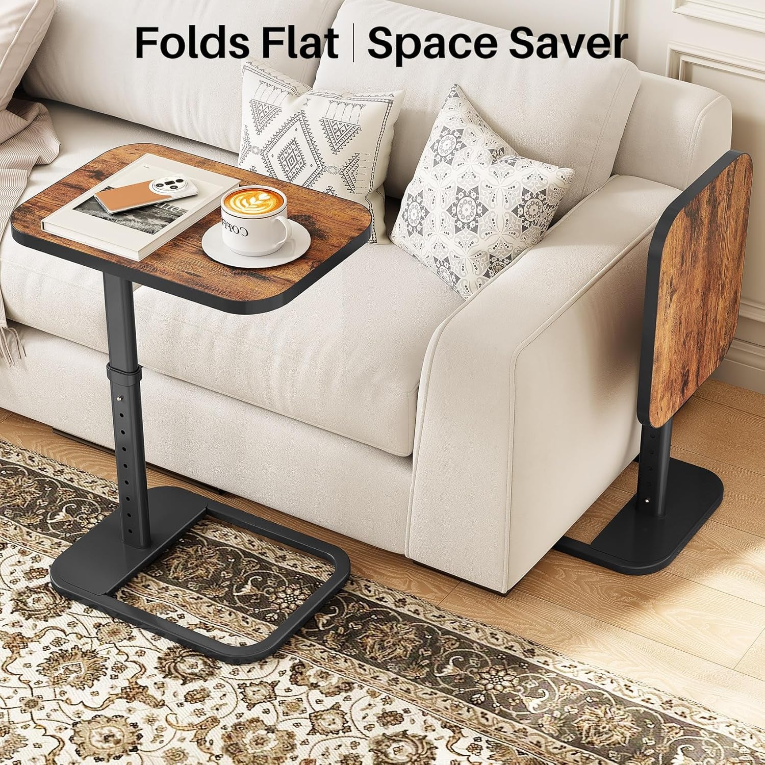Two tables shown: one in use over the sofa and one folded flat standing behind the couch.