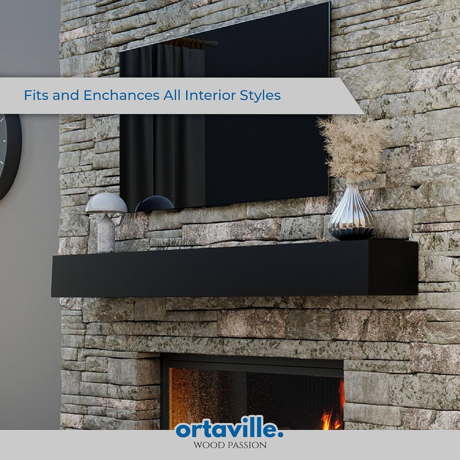 Black floating mantel mounted on stone wall above a fireplace with vase and lamp on top