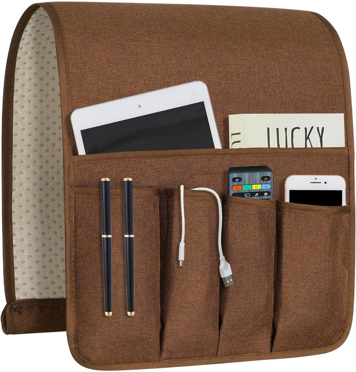 Brown linen organizer front showing five pockets filled with tablet, remote, phone, pens and a USB cable.