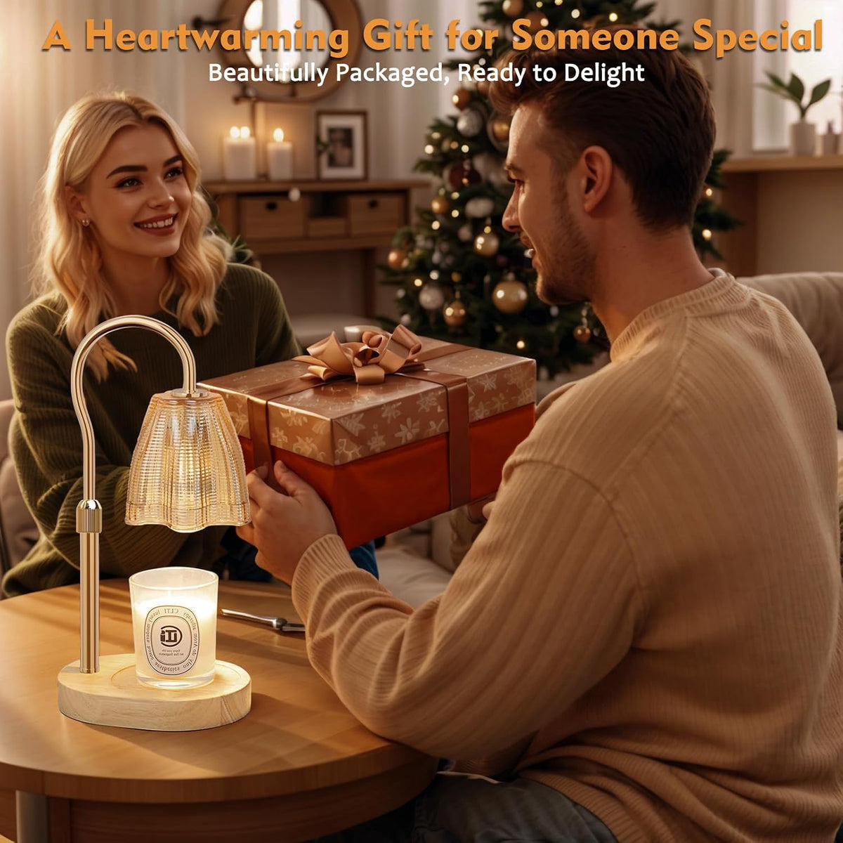 Candle warmer lamp on a table while a couple exchanges a wrapped gift in a living room setting