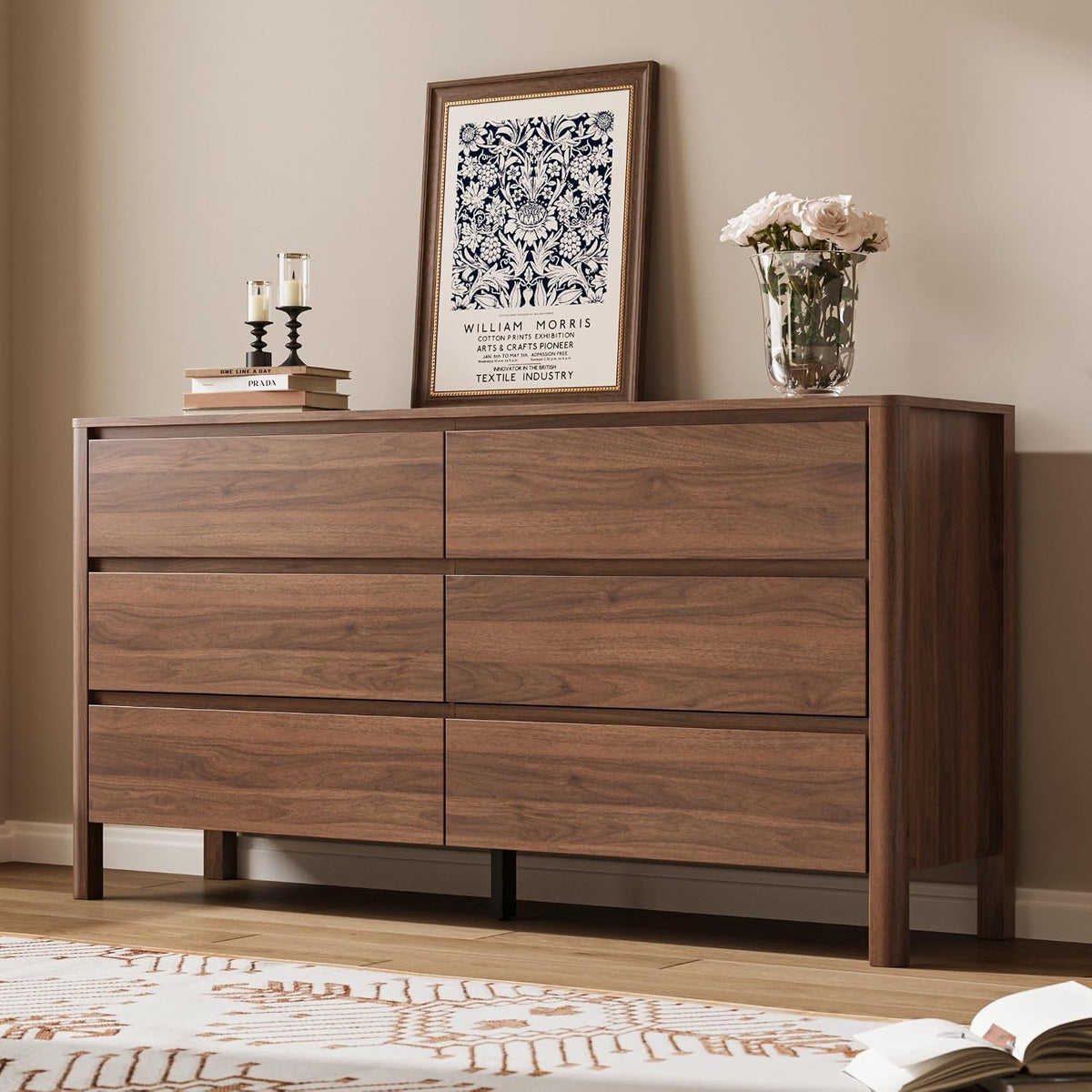 Slightly low, straight-on view of a walnut six-drawer dresser showing flush drawer fronts with hidden finger-groove handles