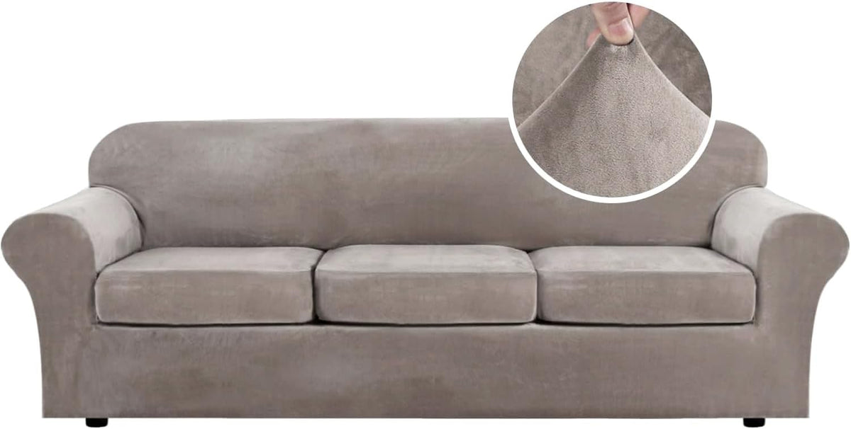 Front view of a light taupe three-seat sofa fitted with a soft stretch slipcover and inset fabric pinch detail.