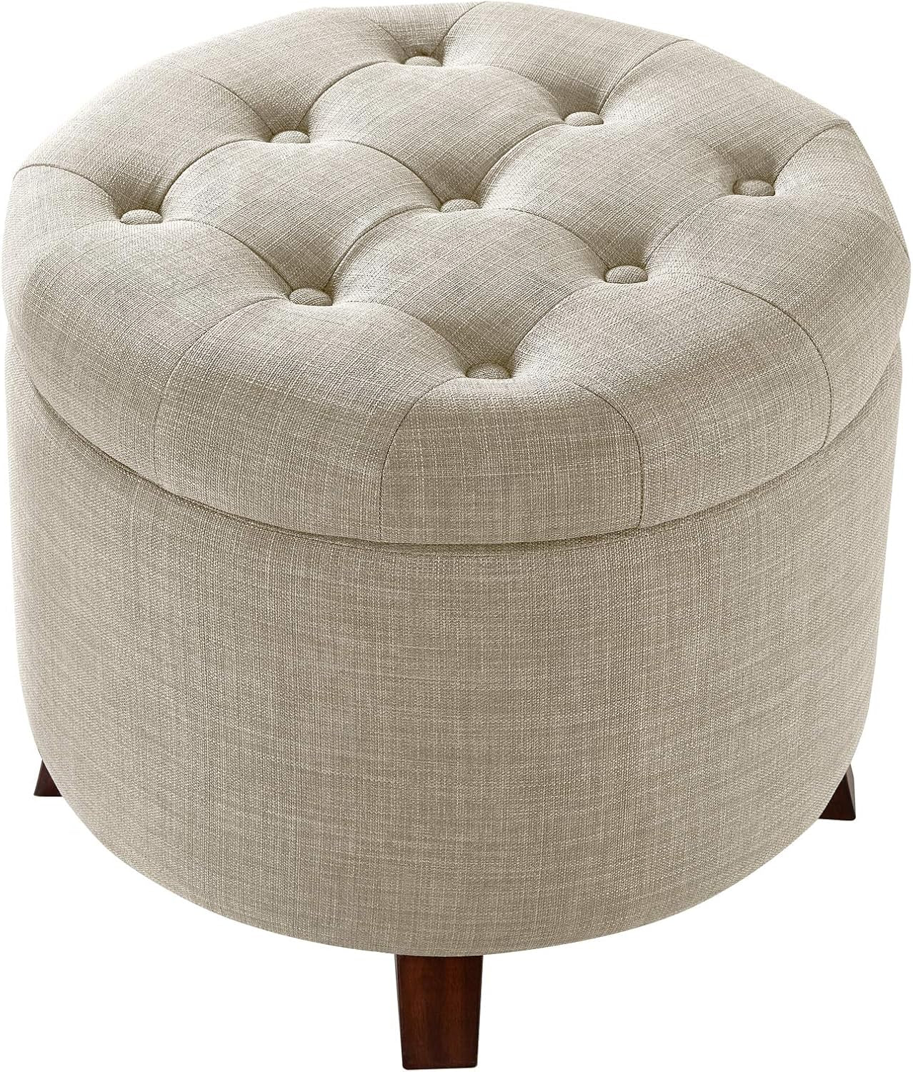 Three-quarter top view showing button tufting on the round linen-style ottoman