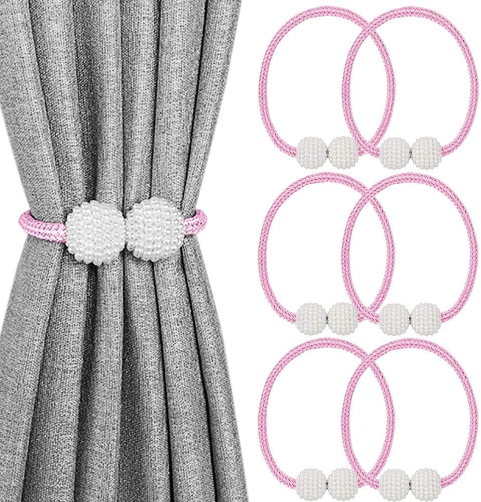 Gray curtain looped with a pink braided tieback featuring two white pearl balls plus five additional pink tieback loops.