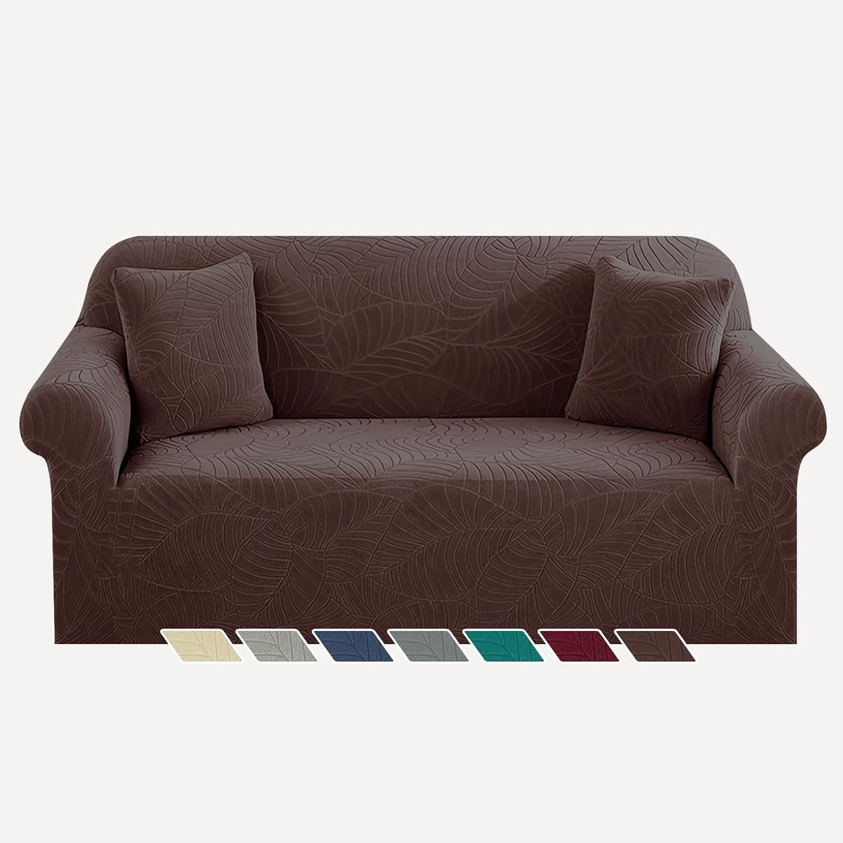 Chocolate brown leaf-pattern sofa cover on a couch with two matching cushions