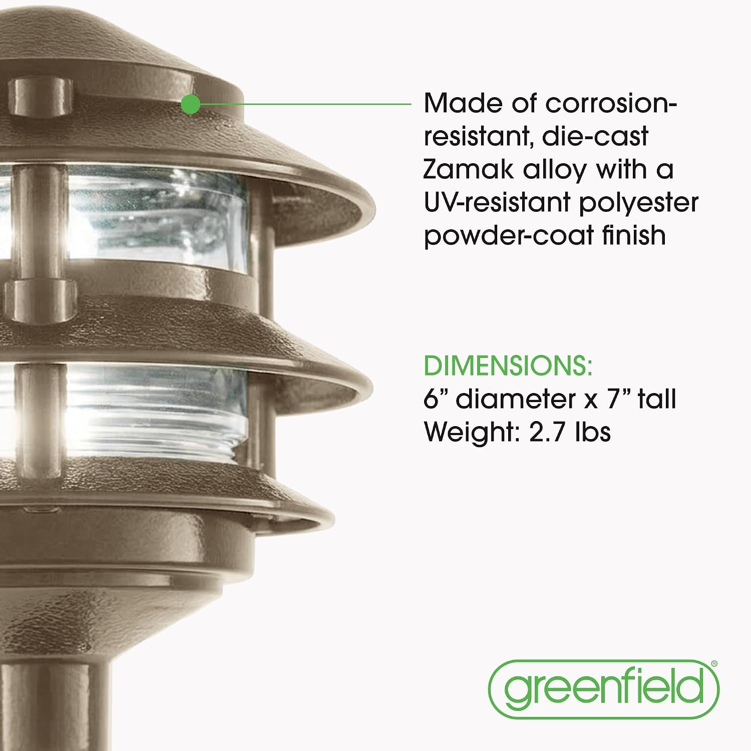 Cropped close-up of the light’s layered metal shades and clear glass diffuser, showing textured finish.