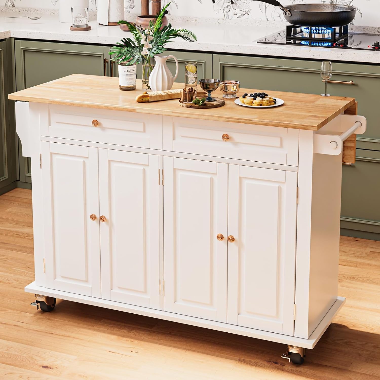 White island with wood top staged in a kitchen, decorated with vase, bread board and plates