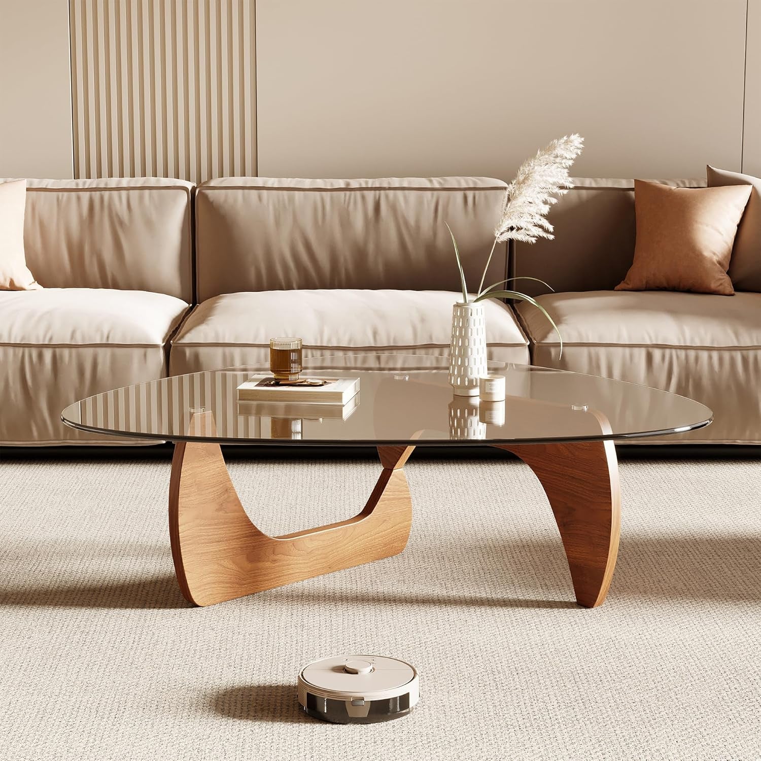 Low front view of triangle tempered glass table with wood-finish base in front of a sofa