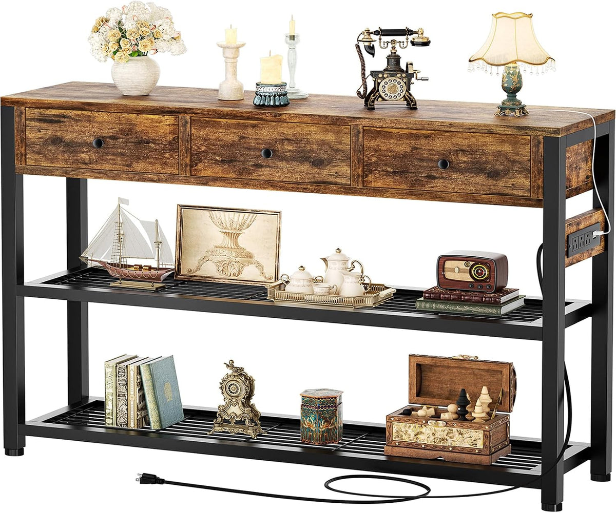 Console table in warm brown oak finish with black legs, accessorized with antiques and a power cord trailing on the floor.