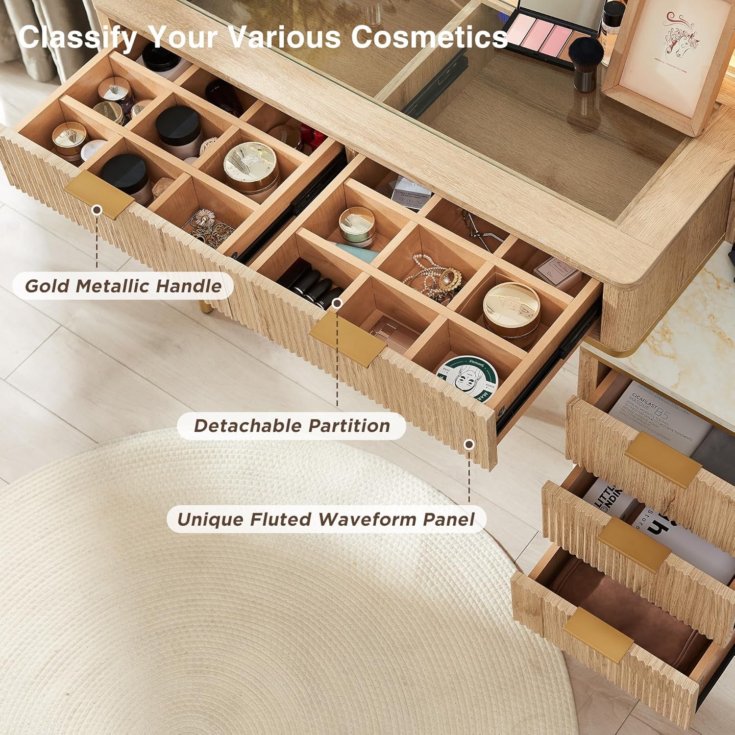 Open drawer view showing removable wooden partitions, fluted drawer front texture and a gold metallic drawer handle