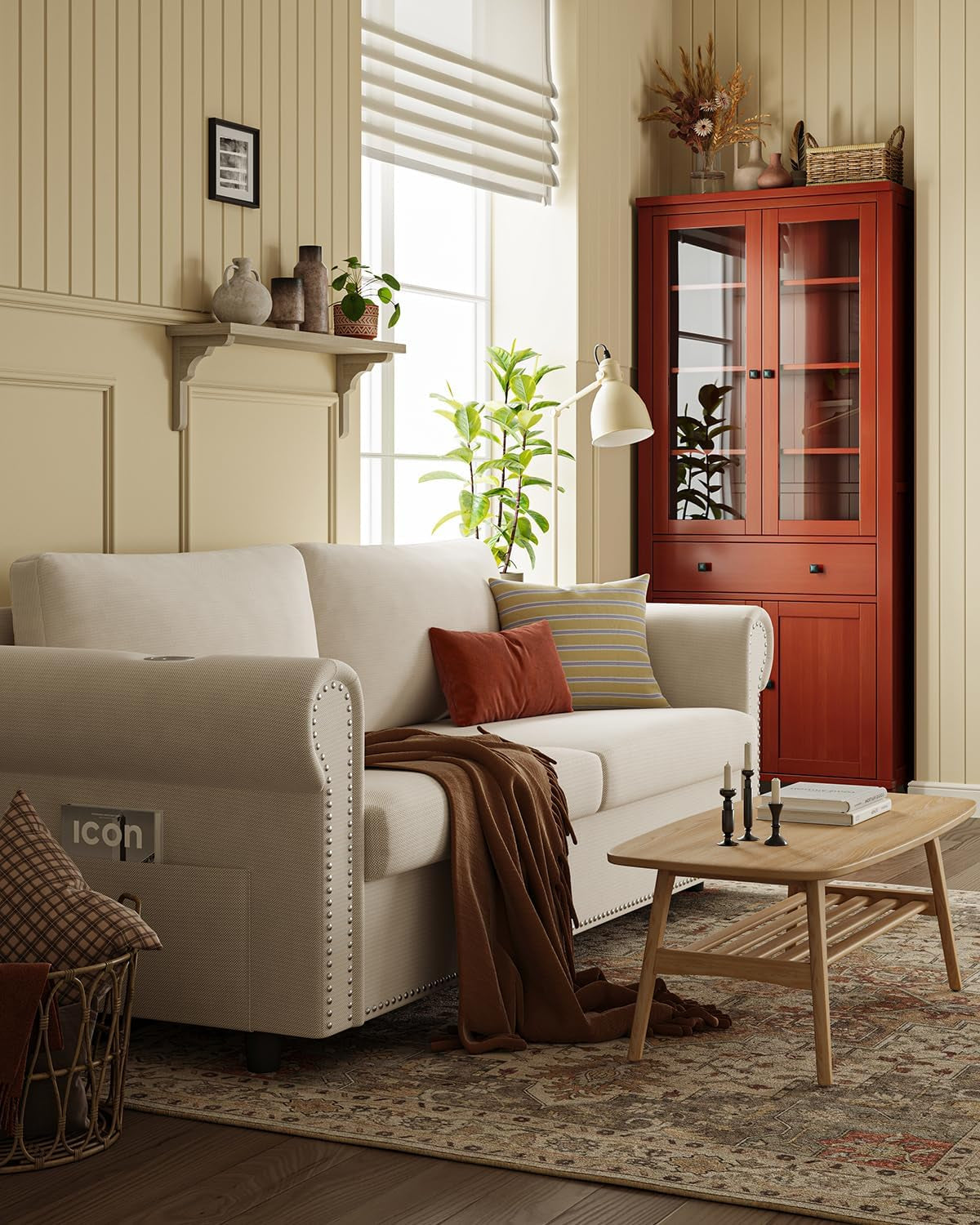 Beige two-seat sofa in a living room, angled side view showing curved armrest and side pocket