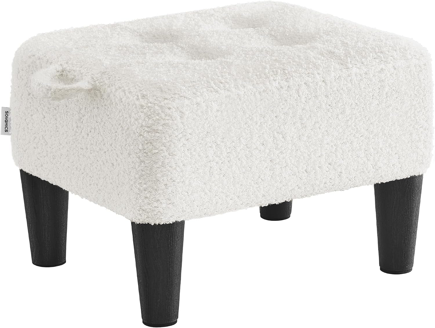 Three-quarter view of a small square tufted ottoman with textured cream fabric and four tapered dark wood legs.