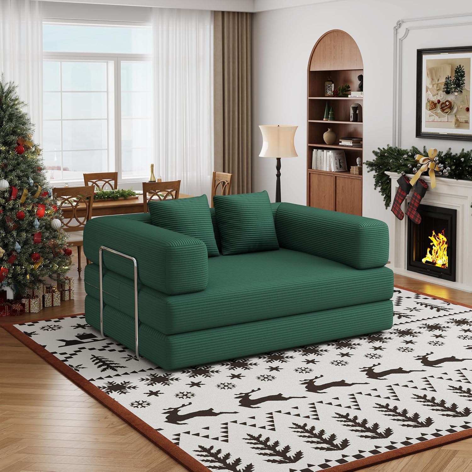 Low-profile green corduroy two-seat convertible floor sofa in a decorated living room