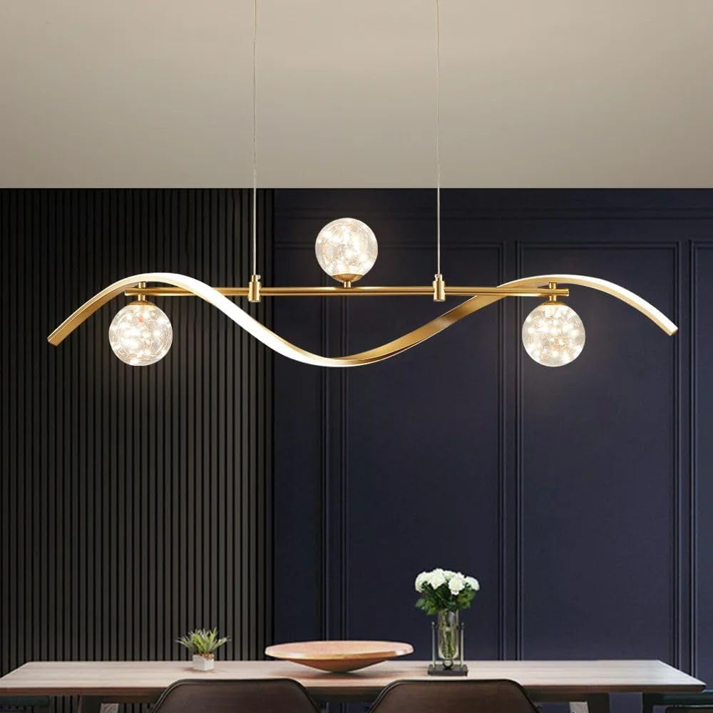 Chandelier suspended over a dining table in a dark paneled room with vase of flowers and table décor below.