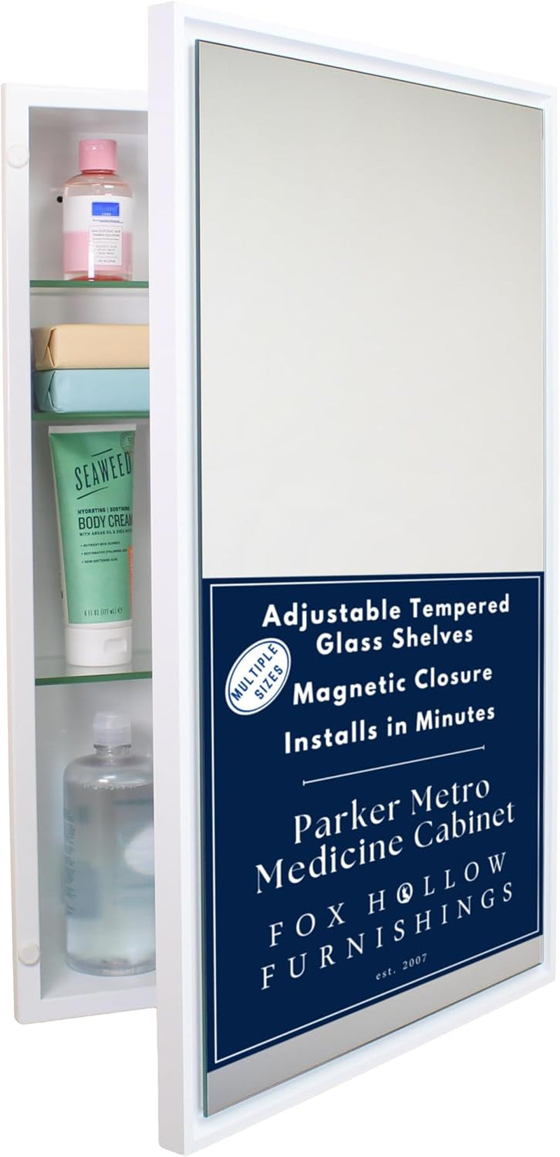 White-framed recessed mirror shown slightly open with product sticker on the mirror and toiletries inside.