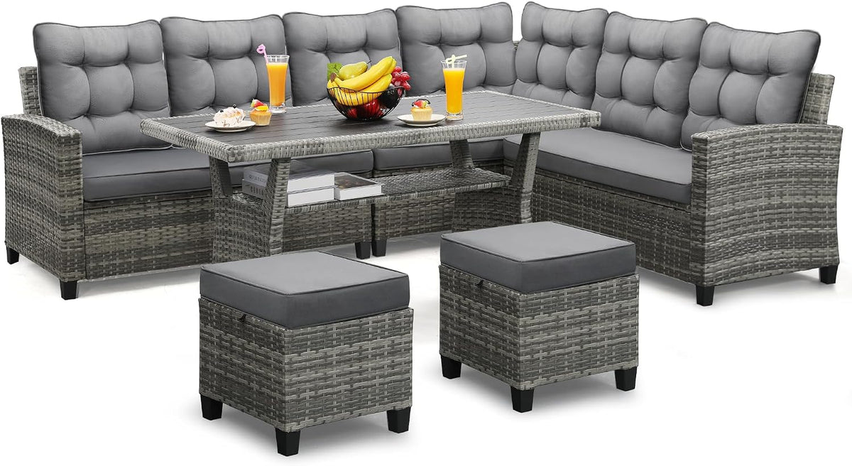 Grey cushioned sectional with tufted back cushions, two ottomans and a rectangular rattan dining table.