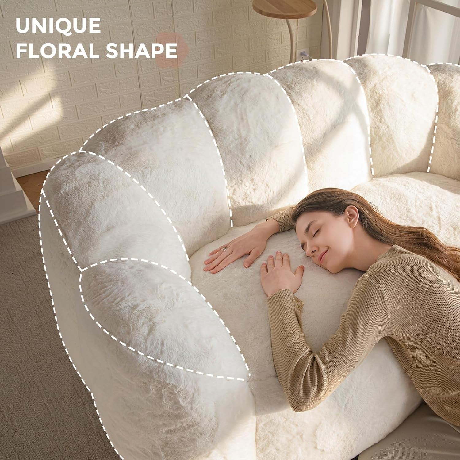Overhead view of the sofa's scalloped floral back with a woman resting on the cushion.