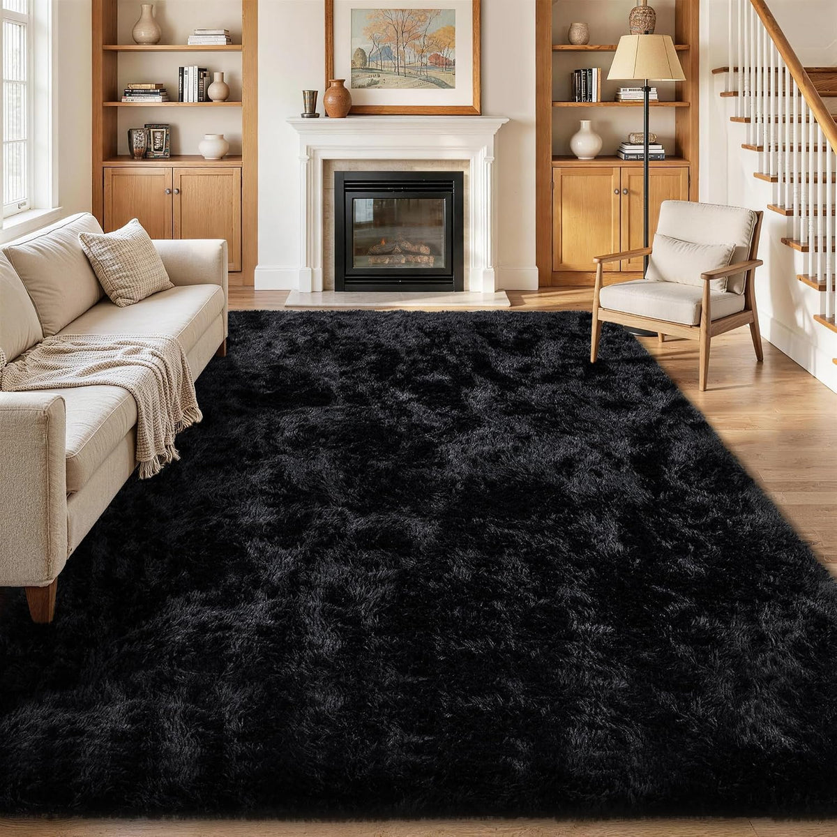Large rectangular black shag rug covering a living room floor near fireplace