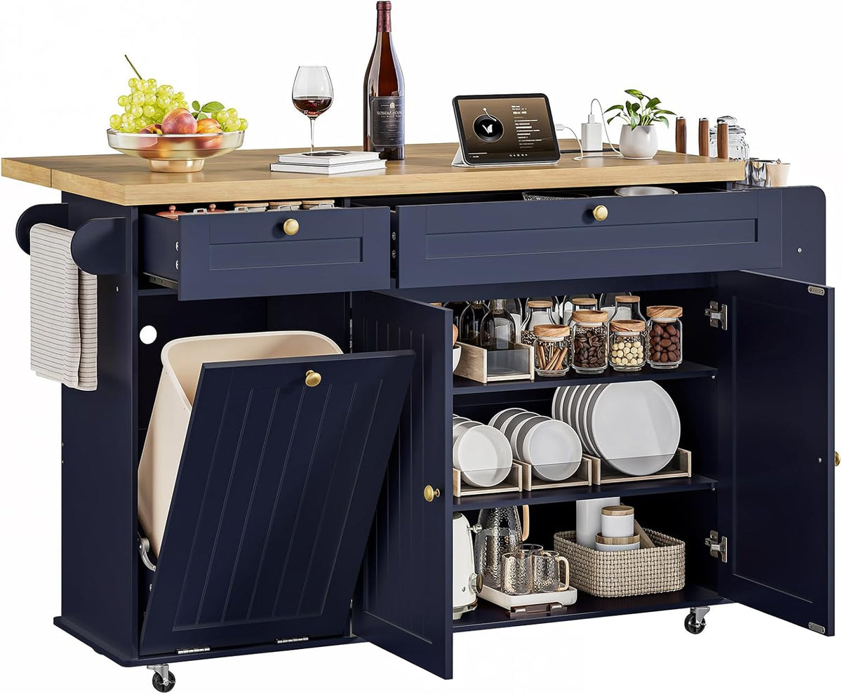 Navy blue island with wood top, drawers pulled out and cabinet doors open revealing organized dishes and jars.
