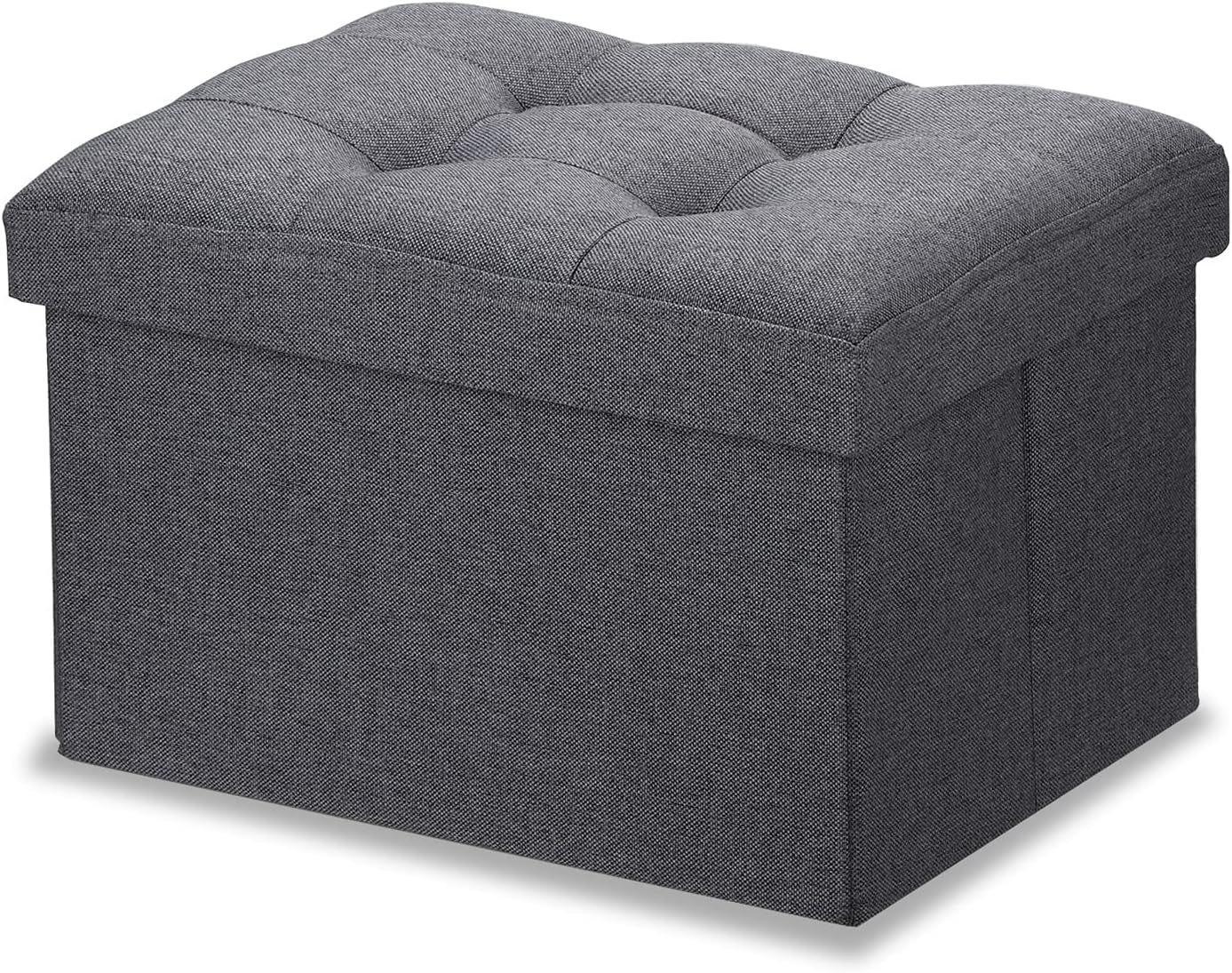Dark gray tufted fabric square storage ottoman angled front view on white background