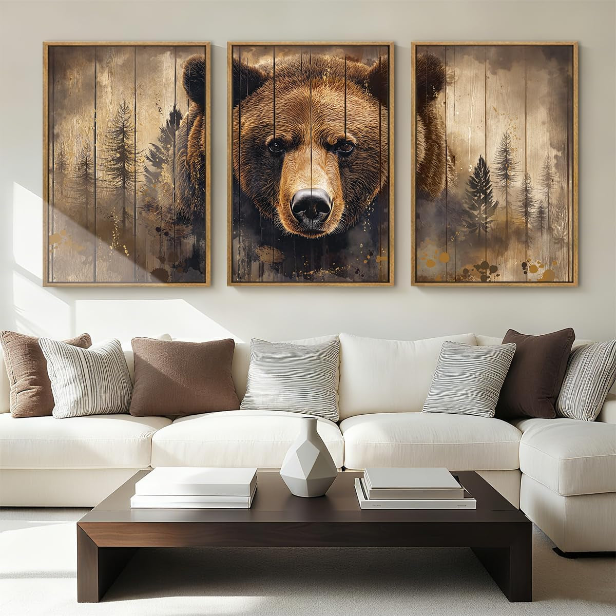 Three-panel framed artwork above a sofa forming a large bear face and forest motif in warm brown tones.