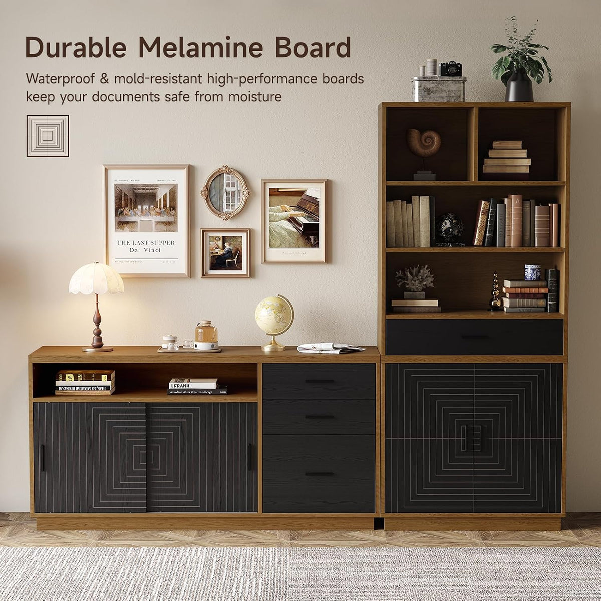 Low credenza and tall cabinet styled together against a wall with lamp, globe and framed artwork above.