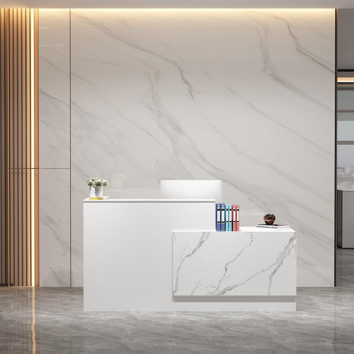 White reception desk with marble-patterned lower panel in a bright lobby with marble wall and floor.