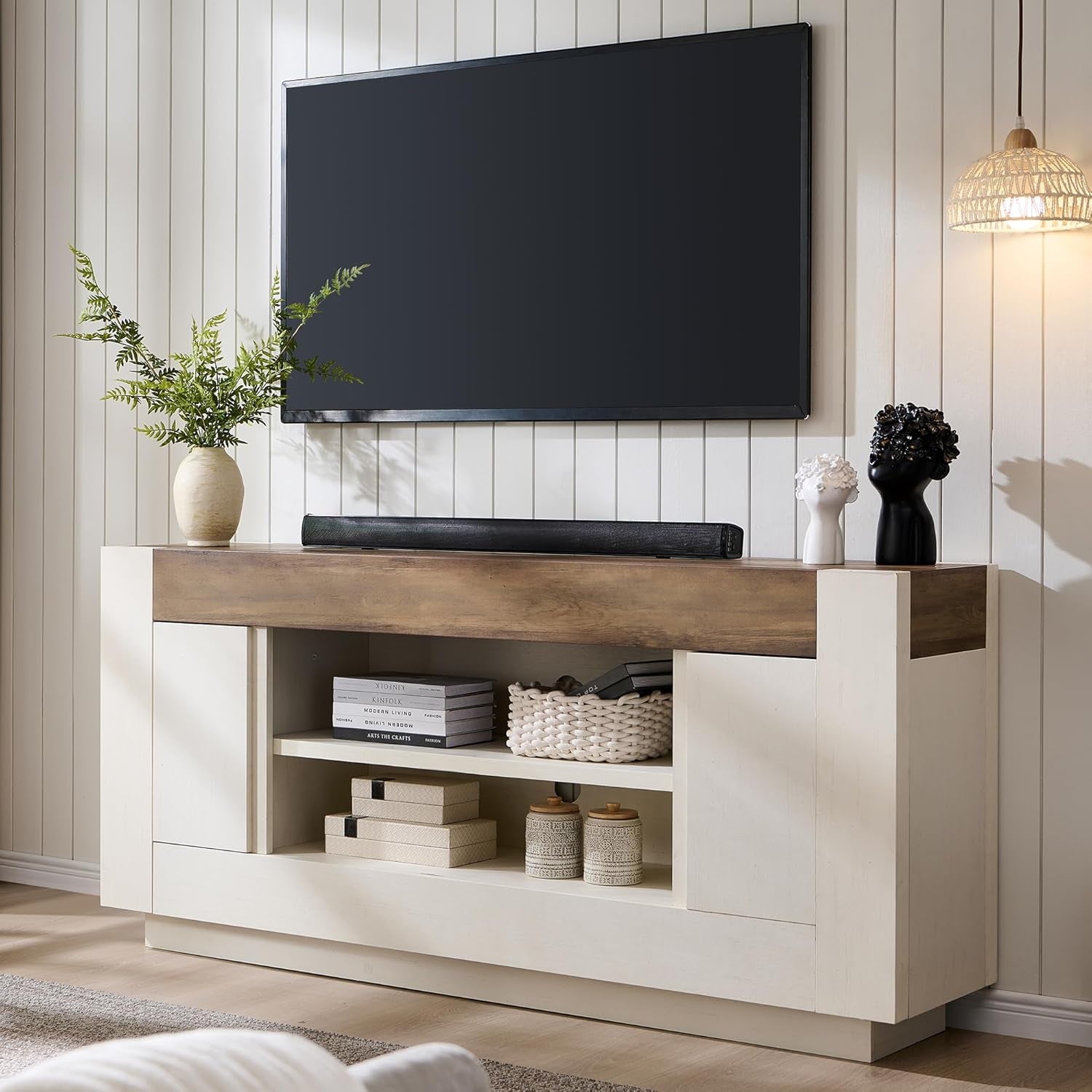 70-inch TV stand in antique white with rustic dark walnut top, front angled view under mounted TV