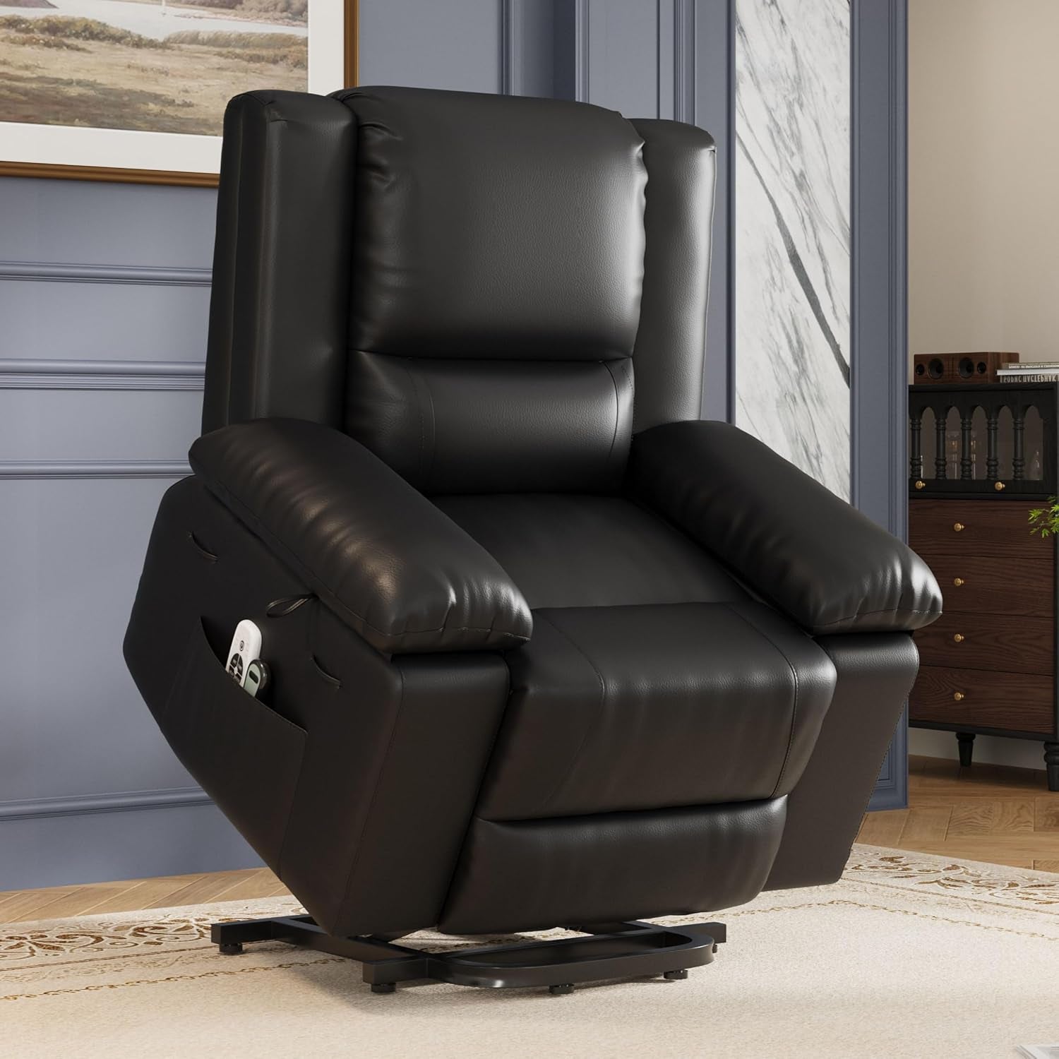 Black recliner shown in a living room setting, positioned upright with plush armrests and tall cushioned back.