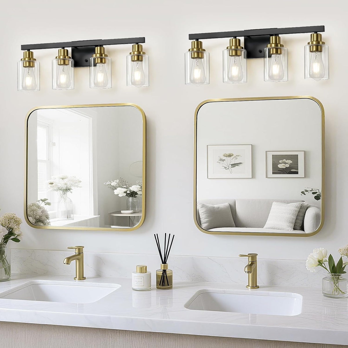 Double-sink vanity with two gold-framed mirrors and matching four-light fixtures mounted above each mirror.