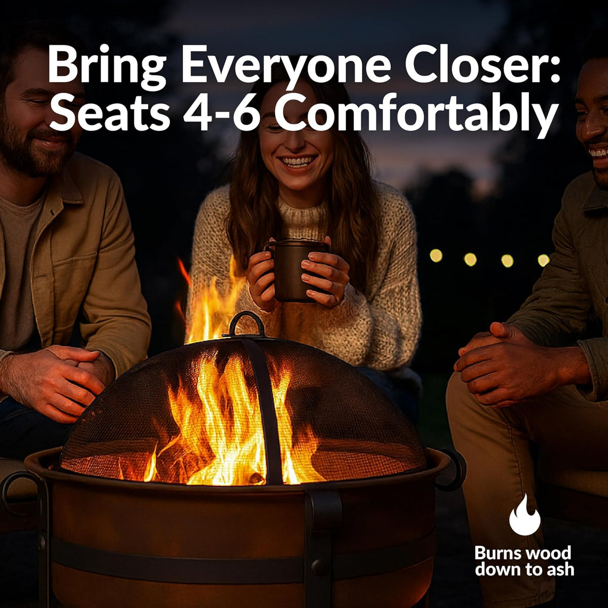 People gathered around a dark bronze round fire pit at night showing flames through the dome spark screen