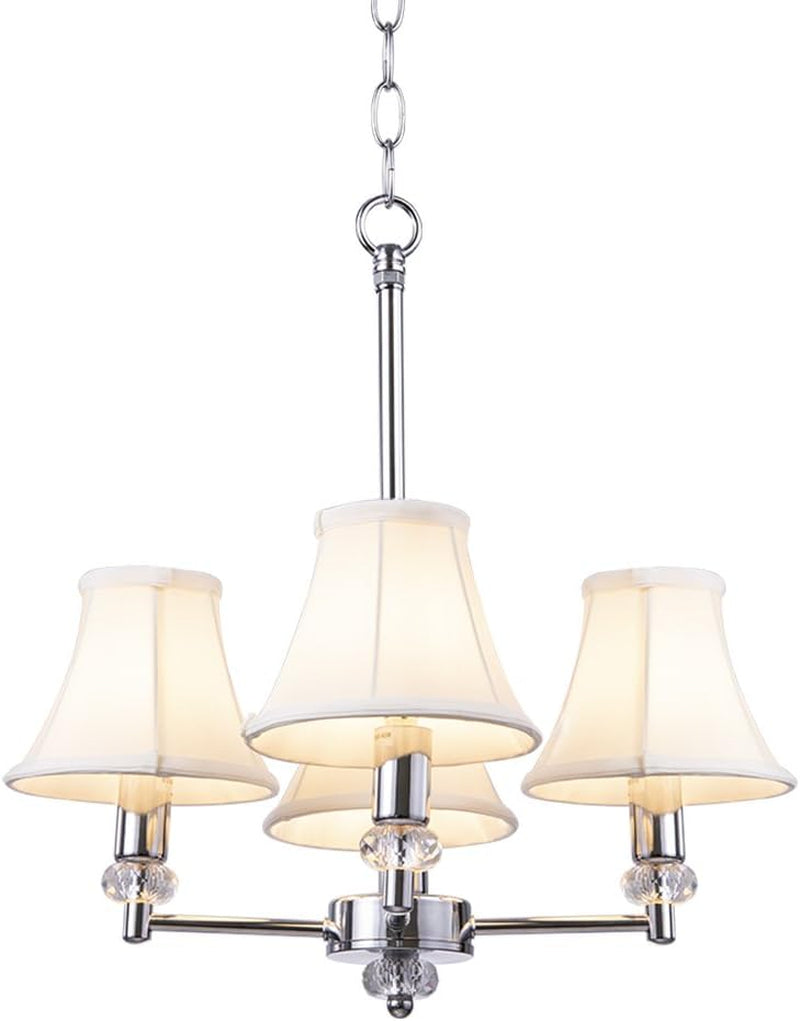Chrome three-arm chandelier with three lit ivory fabric shades on a plain white background