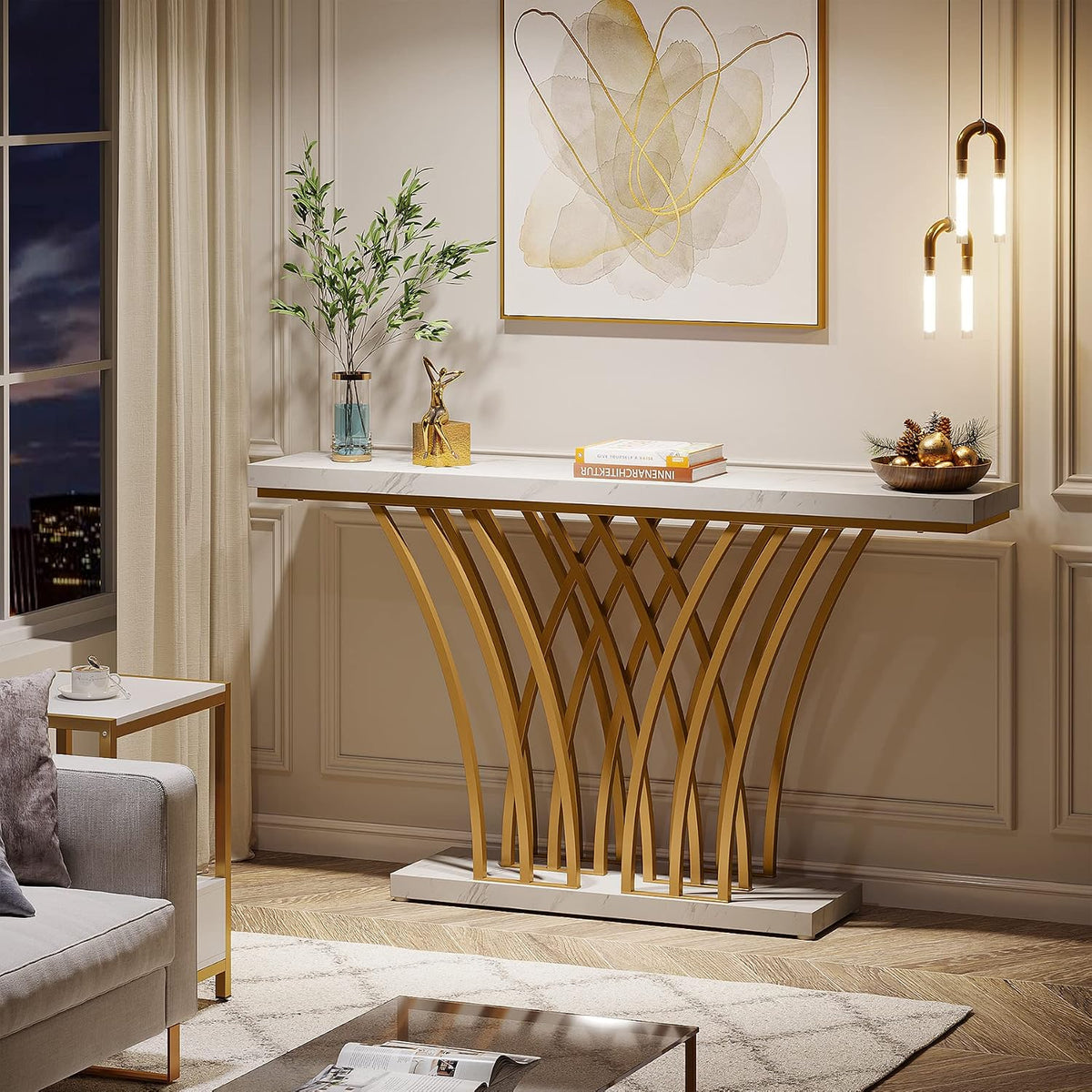 White faux marble console table with gold lattice base shown in a living room setting, front view