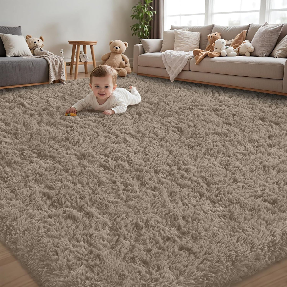 Cozy living room with a taupe shag rug and a smiling baby crawling toward the camera among toys.