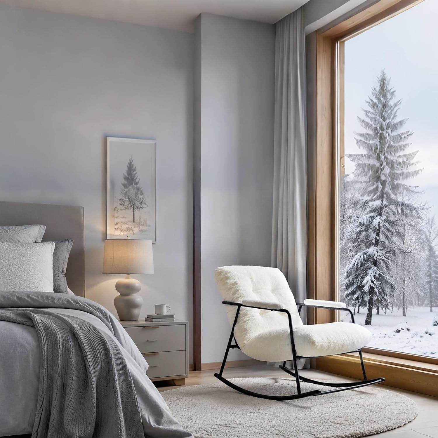 Cozy white rocking chair by a floor-to-ceiling window with snowy view, next to a bedside table and lamp.