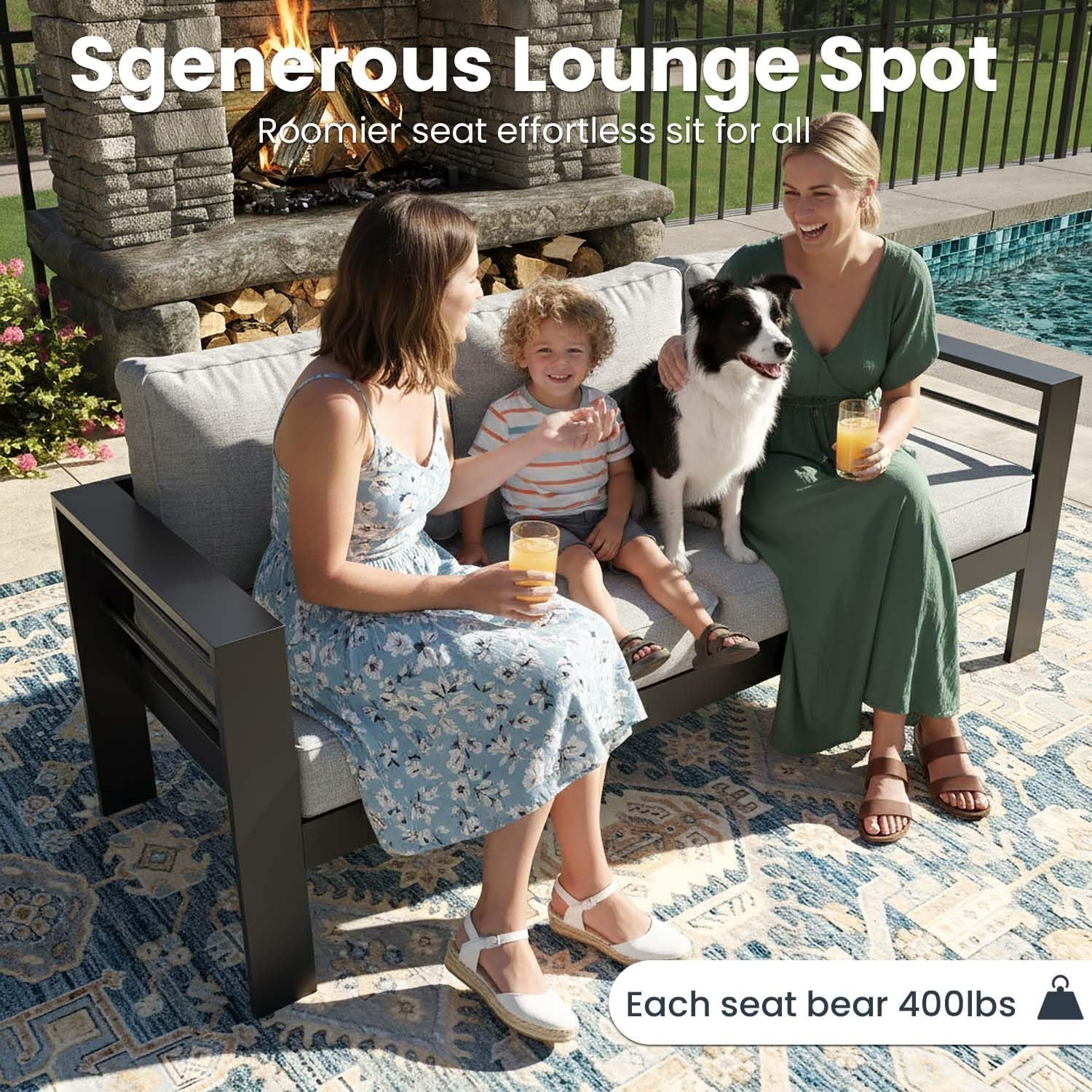 Two people and a child sitting on a three‑seat outdoor sofa with grey cushions on a patio setting