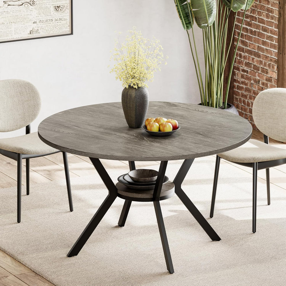 Round grey wood-grain tabletop with metal X-shaped base and lower shelf in a staged dining room