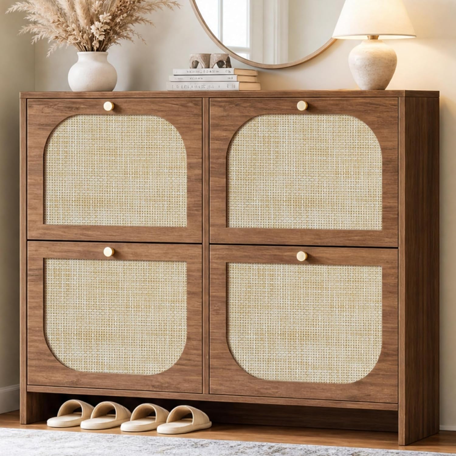 Front view of a double-wide dark wood shoe cabinet with four woven cane-front panels and small gold knobs, slippers below.