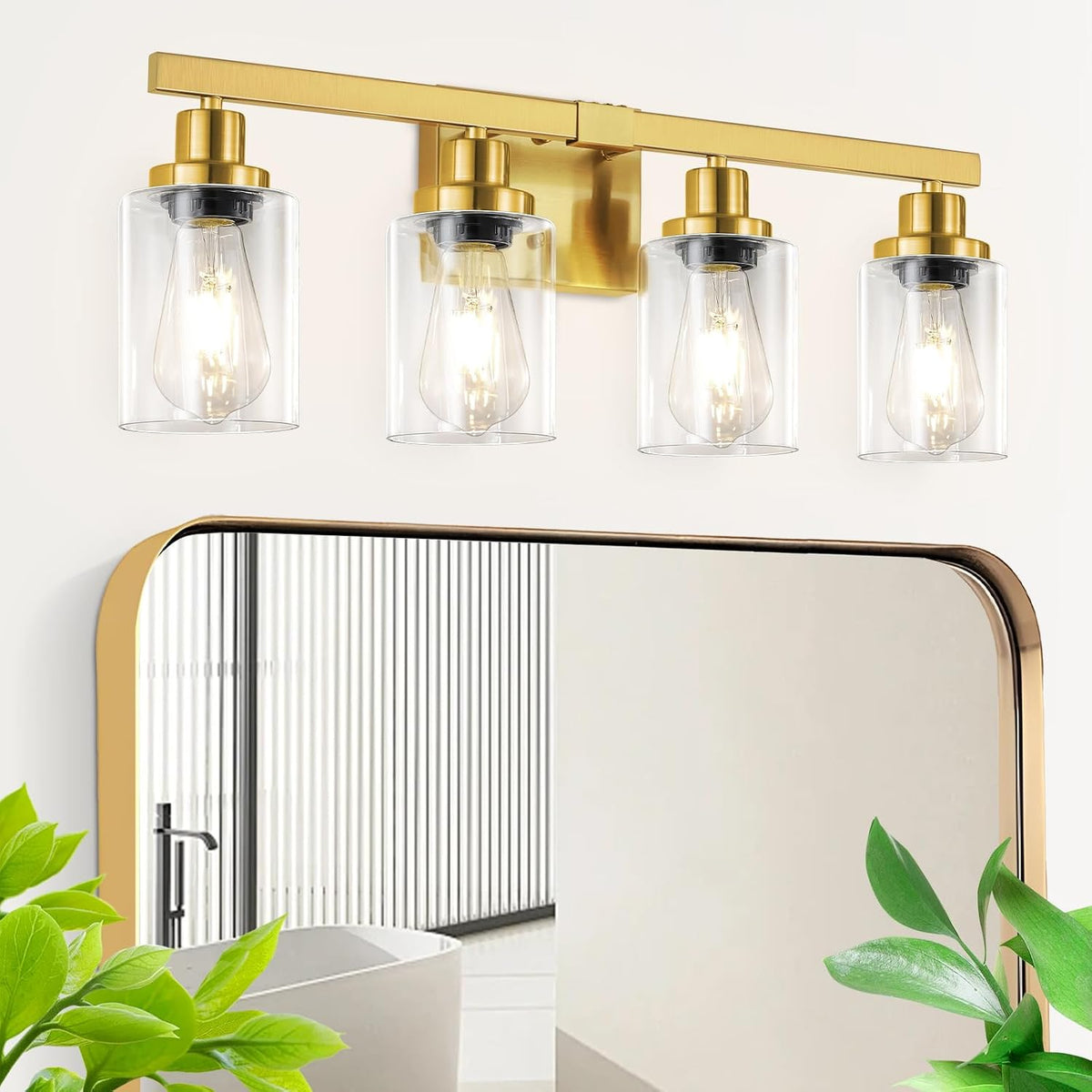 Four-light brass vanity fixture with clear cylindrical shades and a mirror edge shown below