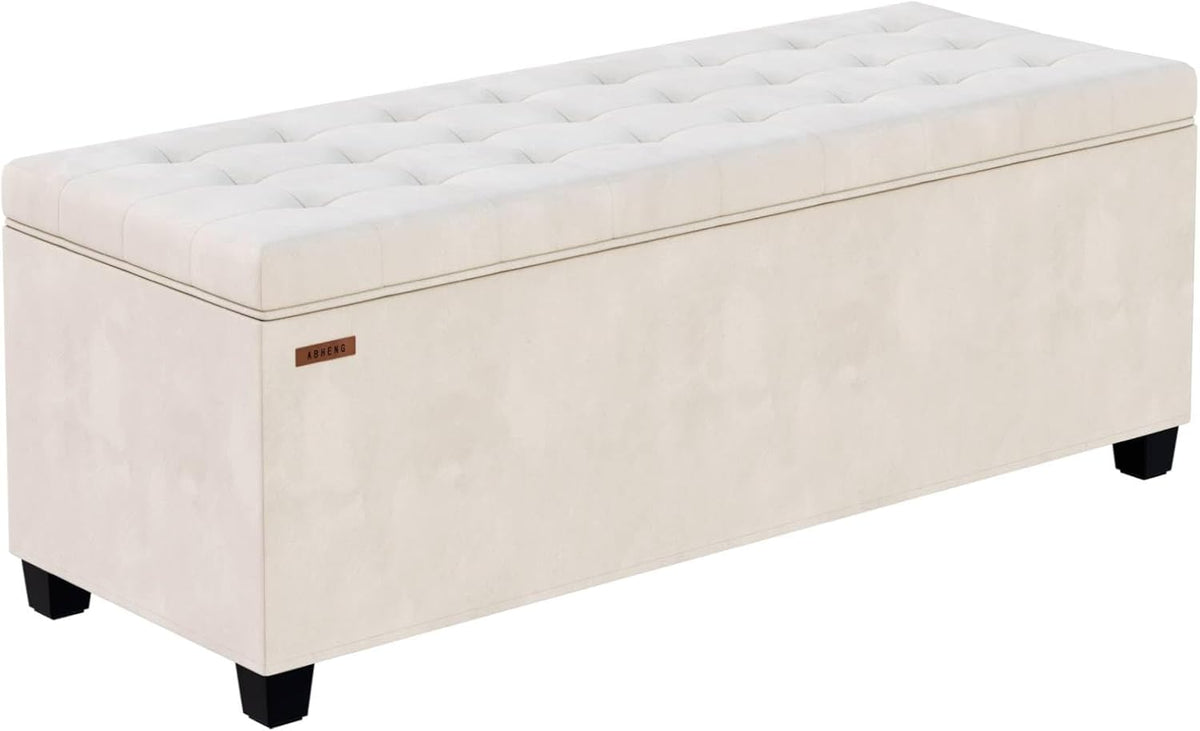White tufted storage bench on a white background, right-front angled studio view showing tufting and legs