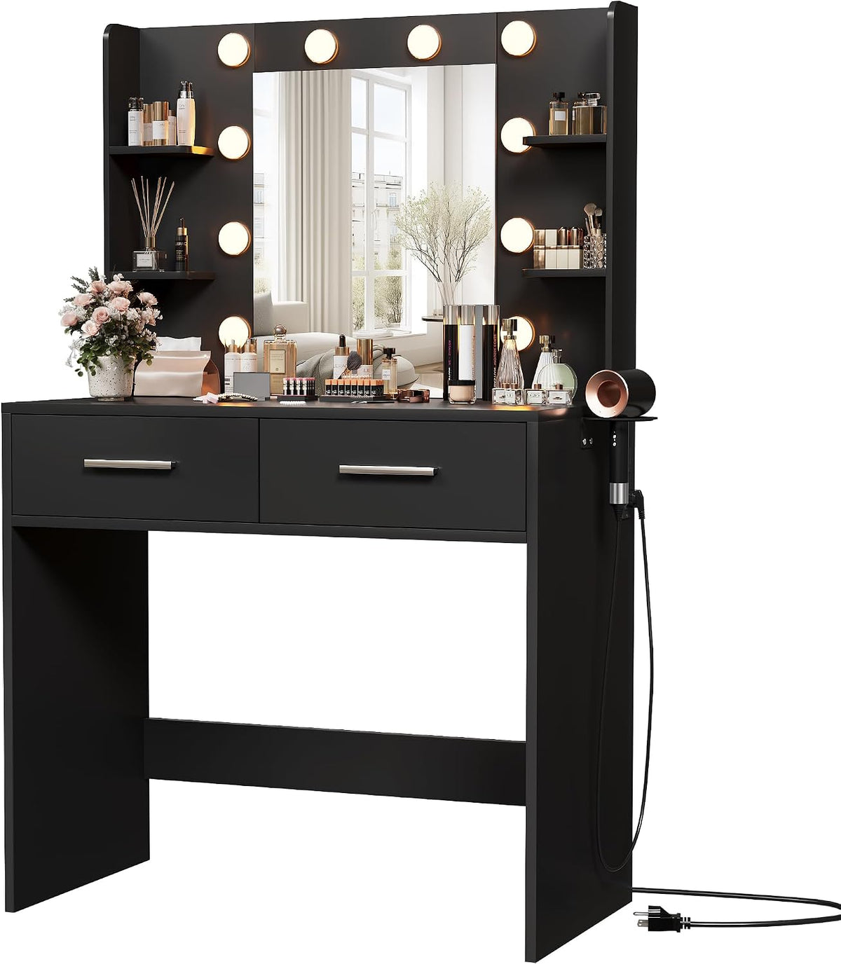 Black vanity with lighted mirror and plugged cord, makeup items on tabletop against white background