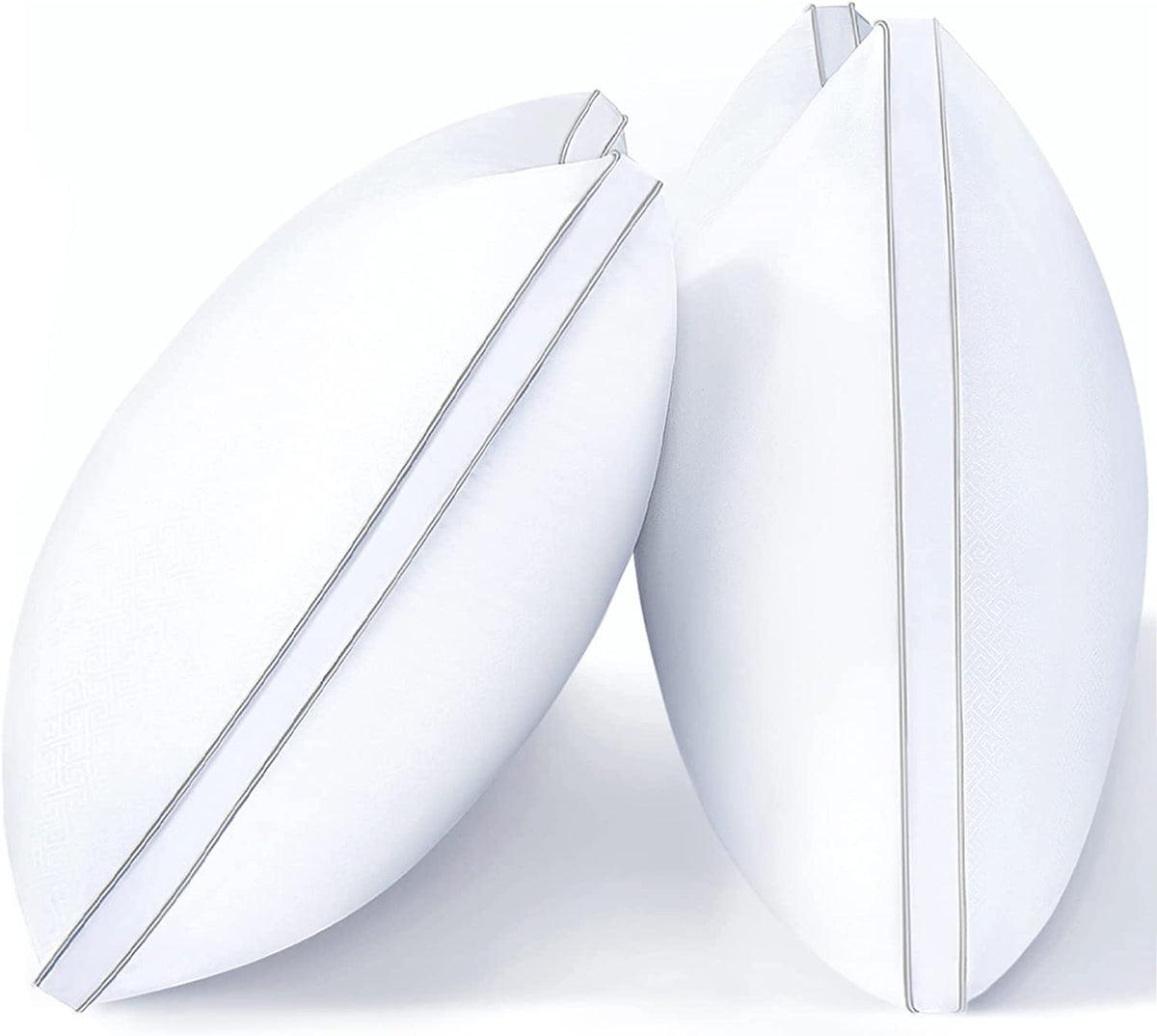 Side view of two white pillows leaning together showing a thin vertical silver piping accent along the seam.