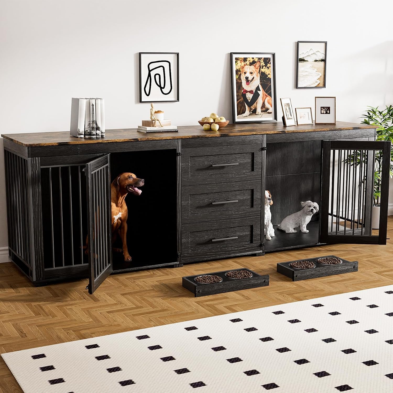 Dark charcoal black double dog crate TV stand with metal-bar doors open and a brown dog sitting inside left compartment.