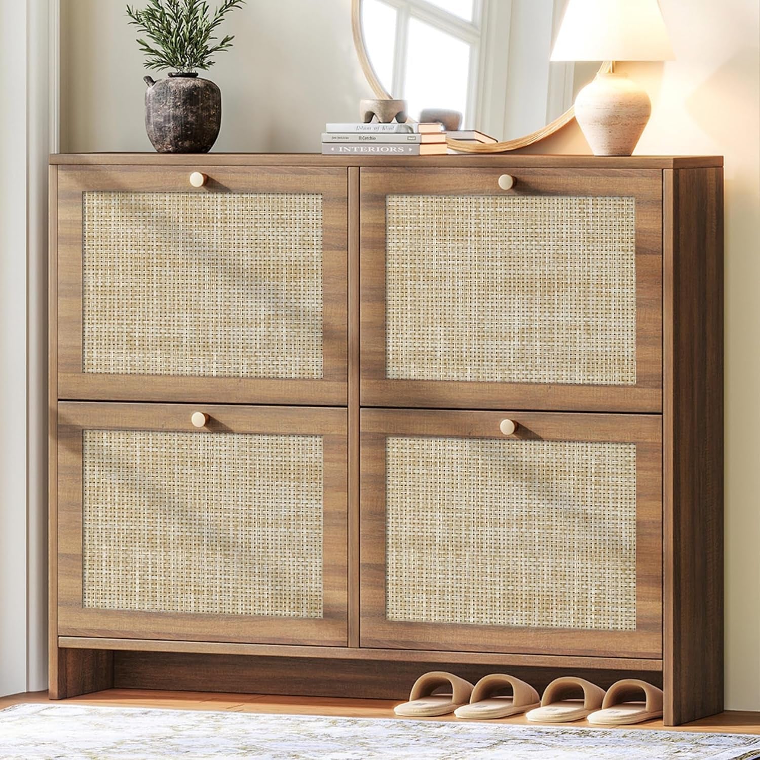 Square four-panel cabinet in medium wood tone with framed cane inserts and a round mirror reflected above.
