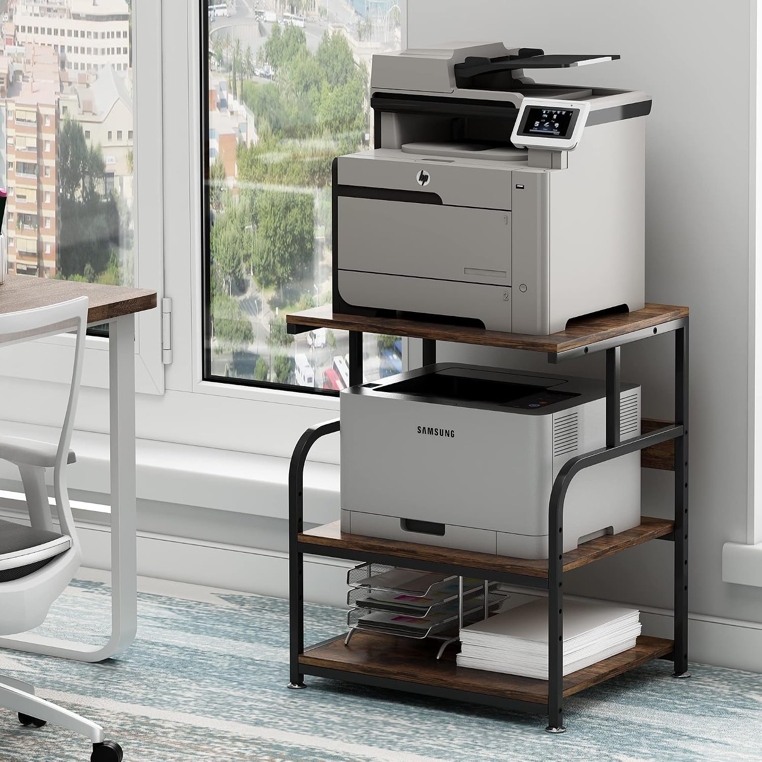 Printer stand with dark wood shelves and black metal frame holding two printers next to a window.
