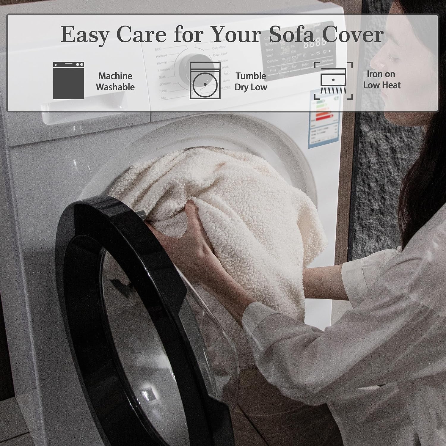 Person placing an ivory textured sofa cover into a front‑loading washing machine drum.